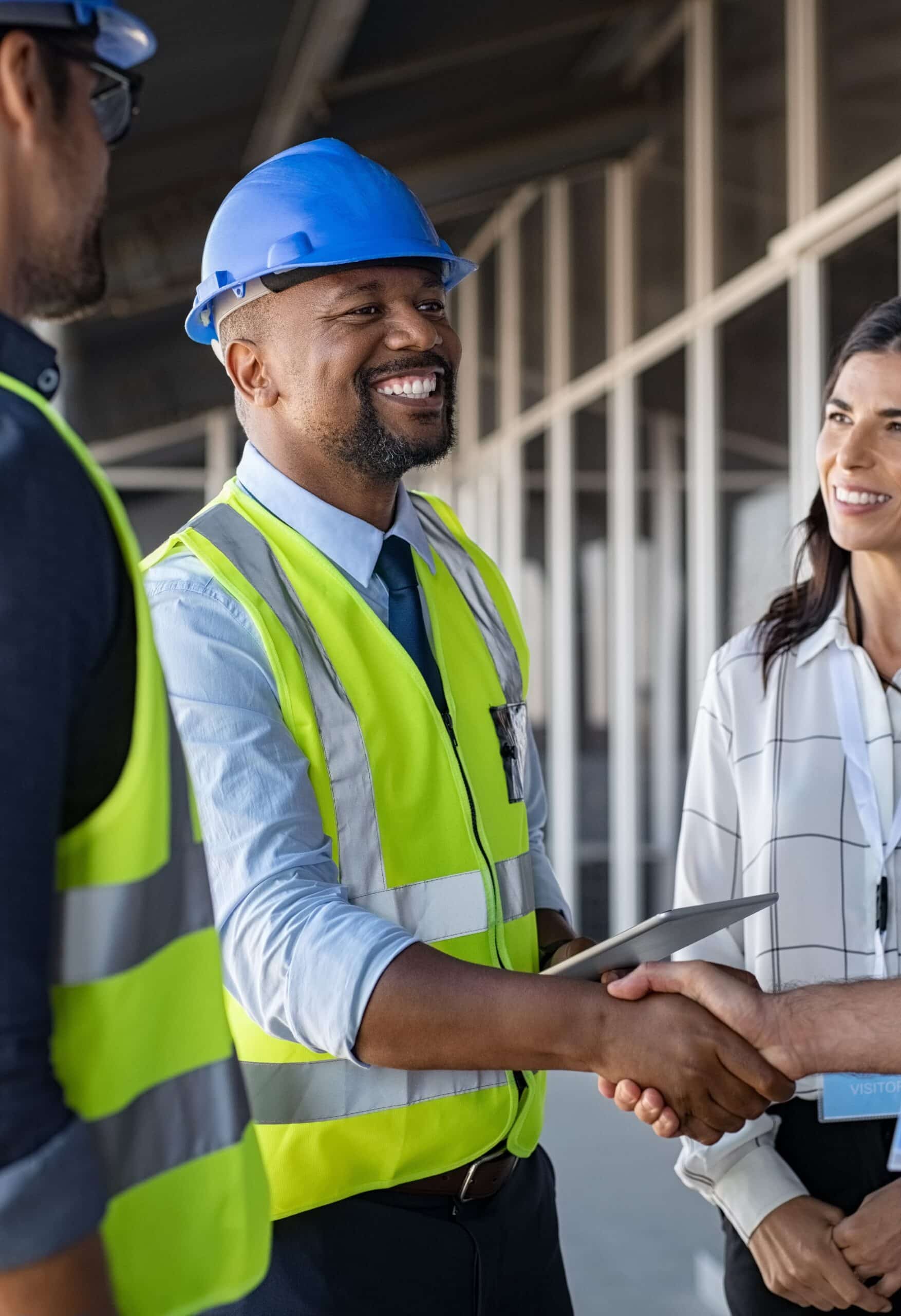 Engineer and businessman handshake at construction site